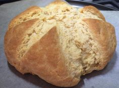 a loaf of bread sitting on top of a piece of wax paper