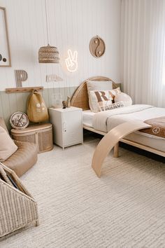 a bed room with a neatly made bed and wicker furniture on the floor next to a window