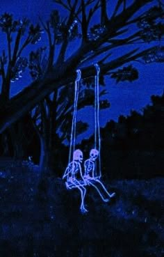 two skeletons sitting on swings at night in the park with trees and sky behind them