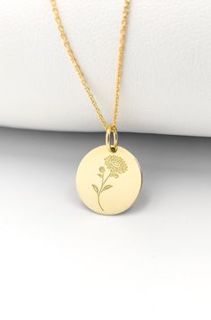 Welcome to ElegantGoldJewels, Find all the information you need about your charm: Material of pendant: 14K Solid Gold Stamp: 585 (14K) Thickness: 0.5mm Jumpring Diameter: 4mm The pendant is available in 6 sizes: - 15mm / 0.59 inches - 18mm / 0.70 inches - 20mm / 0.78 inches - 22mm / 0.86 inches - 24mm / 0.94 inches - 26mm / 1.02 inches - 28mm / 1.10 inches - 30mm / 1.18 inches Chains Information: Rolo Chain: -14K Real Gold - 0.70mm thick - Spring Ring Clasp - 16 inches / 40cm - 0.72 grams - 18 i October Birth Flower, October Birth Flowers, Marigold Flower, Gold Coin, Birth Flower, Rolo Chain, Birth Flowers, Gold Coins, Jewelry Gold