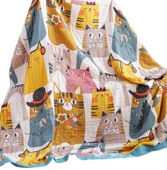 the blanket has many cats on it