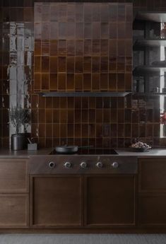 a kitchen with wooden cabinets and tile backsplash