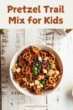 a bowl full of cereal trail mix with the title overlay reading pretzel trail mix for kids