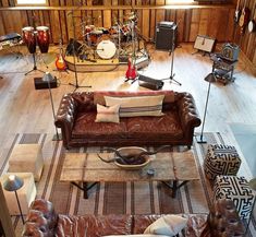 a living room filled with furniture and musical instruments