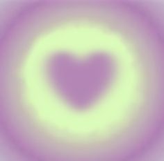 a blurry image of a heart shaped object in purple and yellow colors, with the center surrounded by smaller white circles