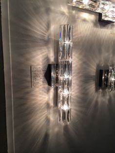 a wall mounted light fixture on the side of a wall