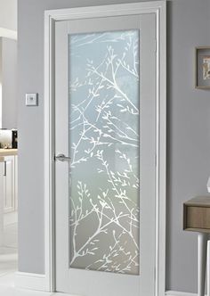 a white door with frosted glass on it