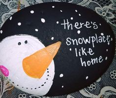 a painted rock that says, there's snowplaise like home