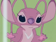 a pink cartoon character with big eyes holding onto a string in front of a green background