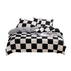 a black and white checkered comforter set with two pillows on the bottom half