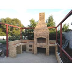 a brick oven sitting on top of a patio