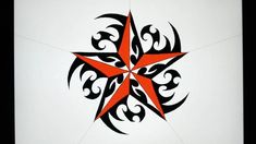 a red and black star on a white wall with swirly designs in the center