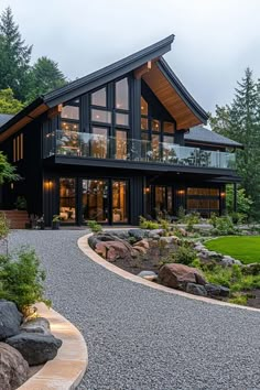 a large house with lots of windows and landscaping