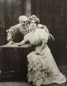 an old black and white photo of two women dressed as zombies sitting next to each other