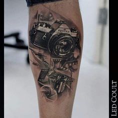 a man with a camera tattoo on his leg