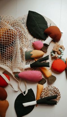 a bag filled with lots of different types of decorative items on top of a table