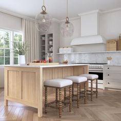 the kitchen is clean and ready to be used for cooking or eating, with stools in front of the island