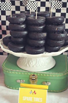 black donuts are stacked on top of each other