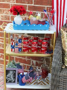 a shelf filled with patriotic items next to a brick wall