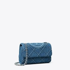 The Small Fleming Soft Denim Convertible Shoulder Bag with diamond pattern pintucks and an embossed Double T. The adjustable chain strap, laced with denim, can be worn doubled over the shoulder or long and crossbody. Denim Wallet, Quilted Denim, Denim Crossbody, Denim Shoulder Bags, Womens Designer Handbags, Woven Chain, Designer Shoulder Bags, Denim Bag, Tory Burch Bag