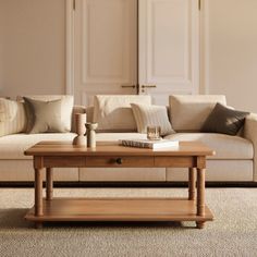 a living room scene with focus on the couch and coffee table in the foreground