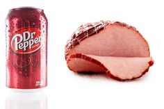 a can of dr pepper soda next to a sliced ham