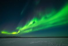 an aurora bore is seen in the night sky