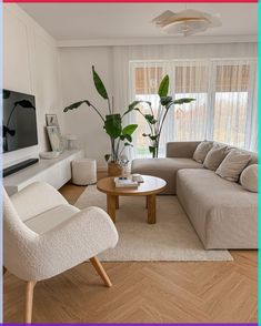 a living room filled with furniture and a flat screen tv mounted on a wall above a wooden coffee table