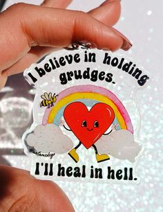 someone is holding up a sticker that says i believe in holding grudges