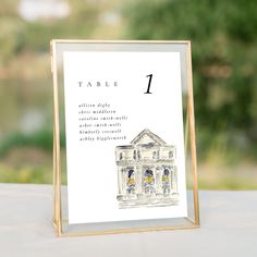 a table number card with an image of a building