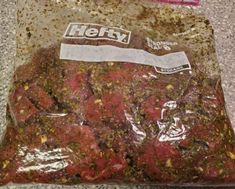 a bag filled with meat sitting on top of a counter