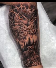 an owl and bear tattoo on the arm