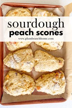 some scones are sitting in a tray with the words sourdough peach stones