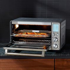 a toaster oven with food cooking in it