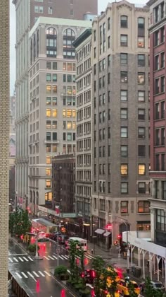 a city street filled with lots of tall buildings