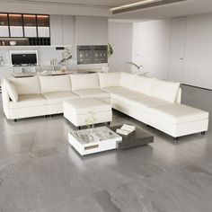 a living room filled with white furniture next to a kitchen