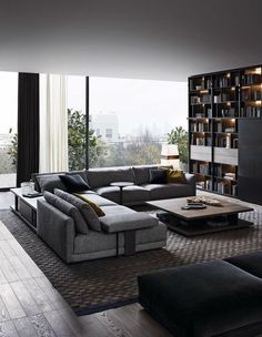 a modern living room with black and gray furniture