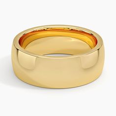 a yellow gold wedding band with an orange stripe in the center, on a white background