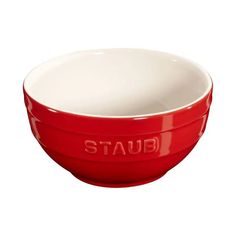 a red and white bowl with the word staub on it