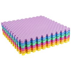 a large stack of lego blocks sitting on top of each other in purple, blue, yellow and pink