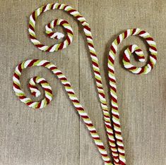 two candy canes sitting on top of a table