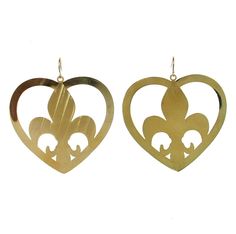 two heart shaped earrings with fleur de lis cut out in the shape of a heart