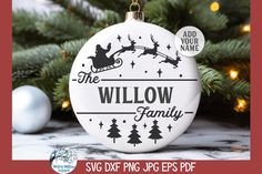 the willow family christmas ornament is hanging from a tree