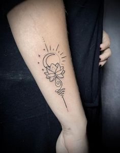 a woman's arm with a tattoo on it that has a sun and a flower