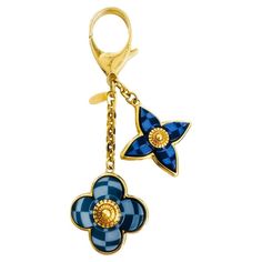 Louis Vuitton Mosaique Bag Charm The brand’s signature blooming flowers emblems in blue with mosaic detailing set on a gold base with decorative gold centre. Linked with gold chain with D-Ring claps having ‘Louis Vuitton’ engraved plaque. Size – One Size Condition – Very Good Composition – Metal Comes with – Charm Only Magnets For Fridge, Uni Bag, Brand Mark, Engraved Plaque, Bracelet Love, Unique Bags, Blooming Flowers, S Signature, Small Accessories