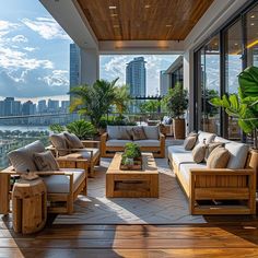 an outdoor living area with wooden furniture and large windows overlooking the cityscape in the distance