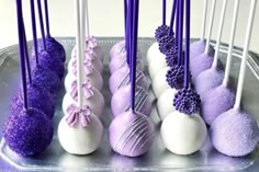 there are many purple and white cake pops