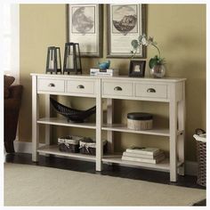 a white console table with two drawers