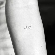 a person with a small tattoo on their arm