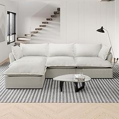 a living room with a large white sectional couch